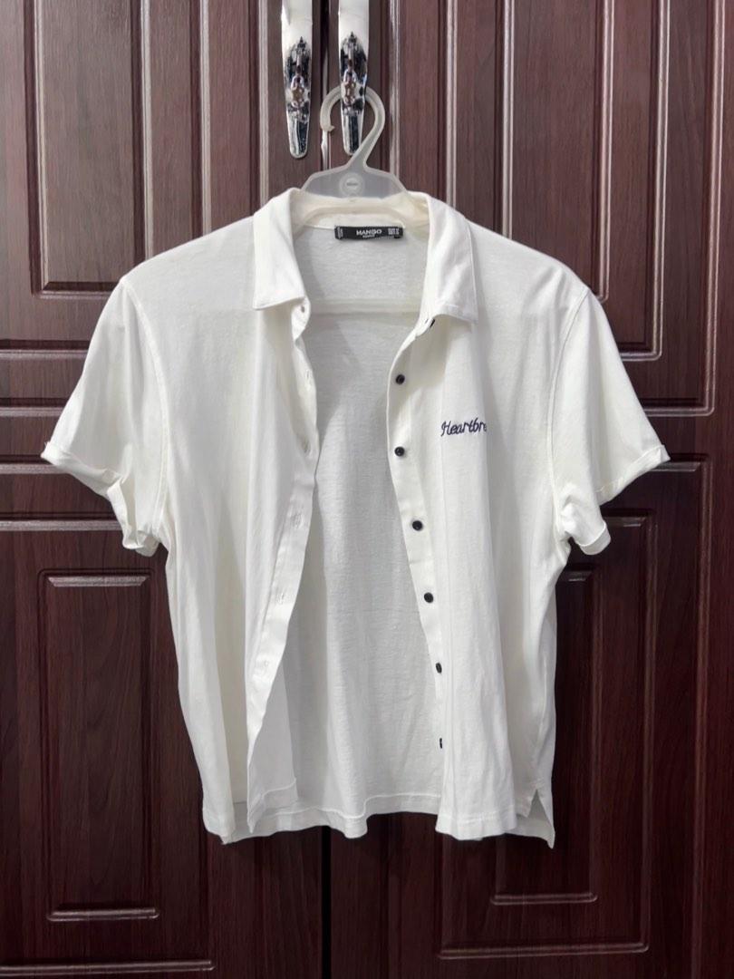 Women’s White Mango Button-down Blouse (Category: Blouses) located in Boac. Submitted by honeybeecat (Listing ID 1190217577, Image 1). Description: Comfortable cotton buttondown. “Heartbreaker” is embroidered on the chest. Has a couple of small minor stains (shown in the pictures) RFS: Not my style - Meet up around UST - Lalamove or J&T (Shipping fee shouldered by the buyer) Price is negotiable.