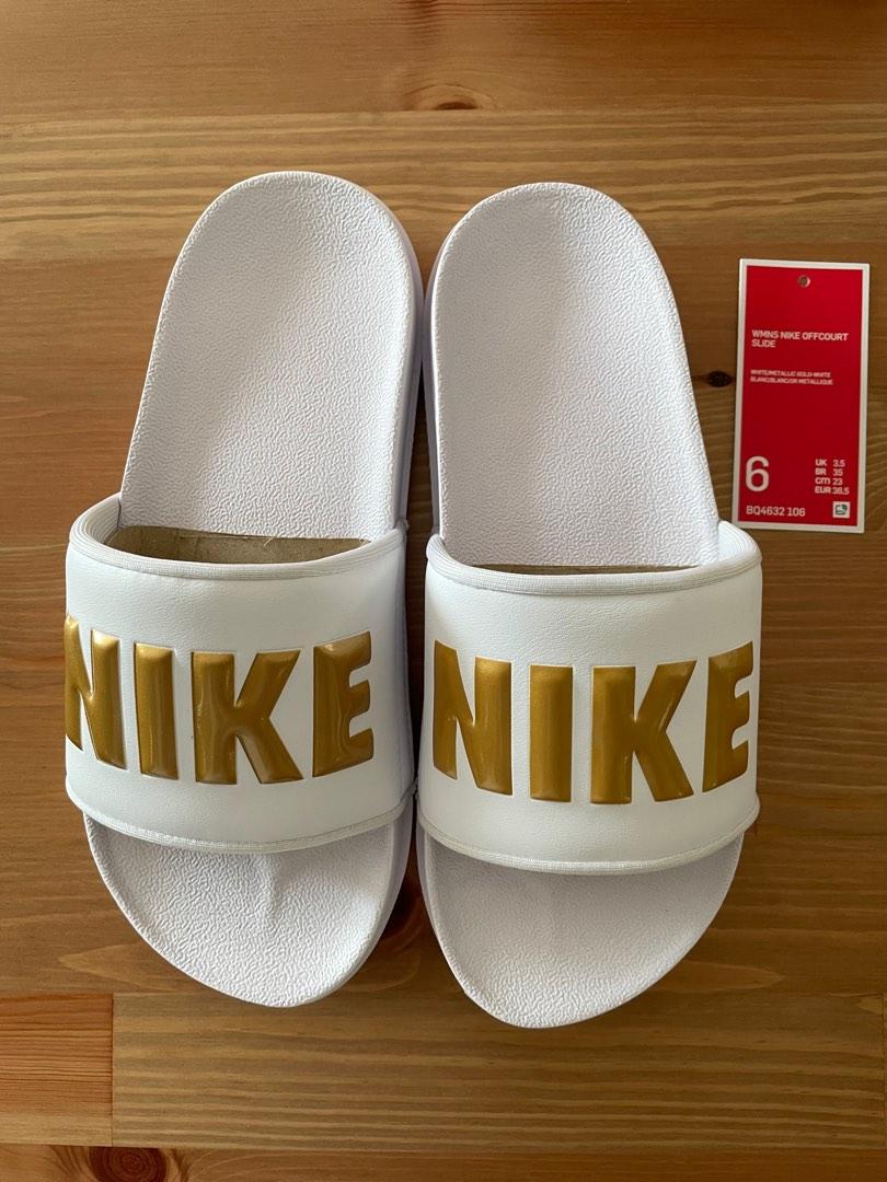 White and hot sale gold nike slides