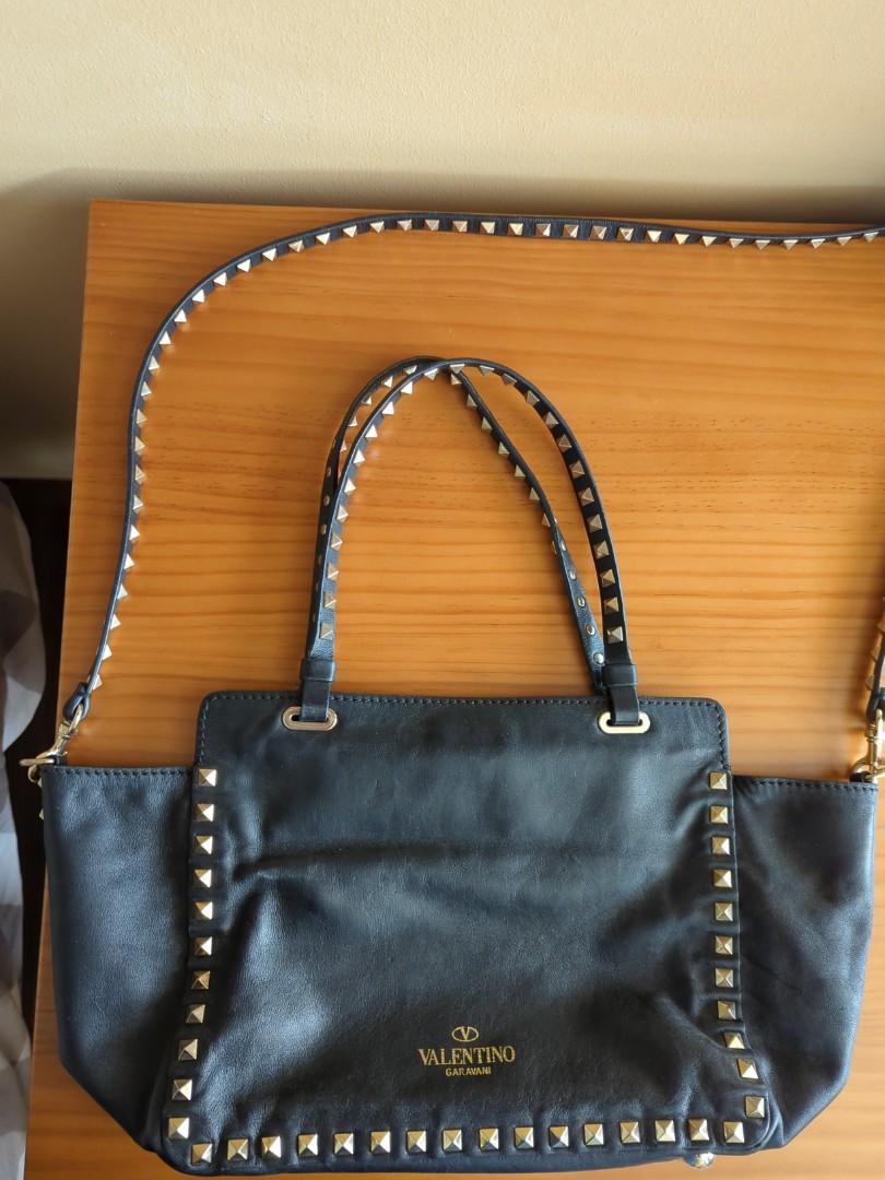 Valentino rockstud leather tote (Category: Bags & Wallets) located in Singapore. Submitted by Ericaaaaaaaaac (Listing ID 1190325310, Image 2). Description: black leather signature Rockstud detailing detachable shoulder strap two top handles flip-lock fastening dimension: (approx) 20cm x 25cm x 10cm clear of unused bags....