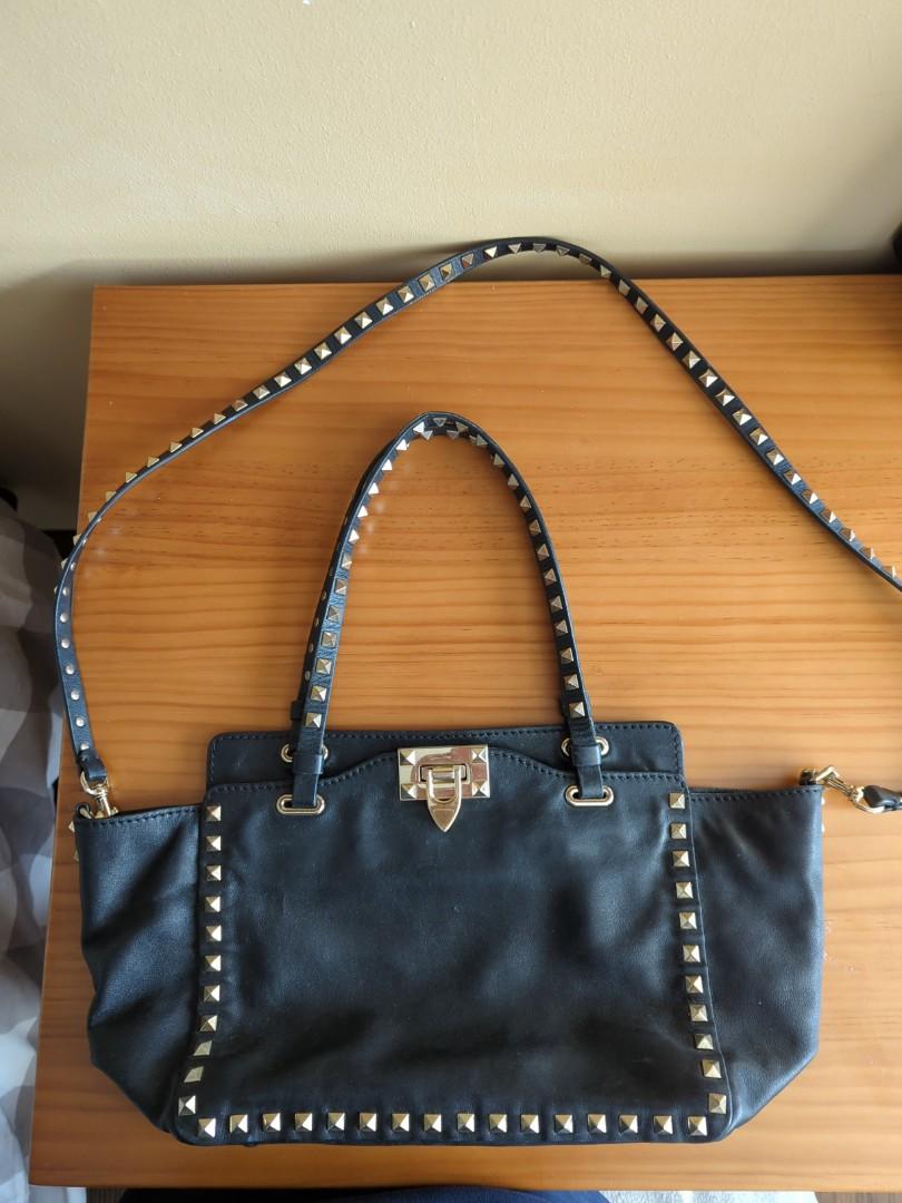 Valentino rockstud leather tote (Category: Bags & Wallets) located in Singapore. Submitted by Ericaaaaaaaaac (Listing ID 1190325310, Image 1). Description: black leather signature Rockstud detailing detachable shoulder strap two top handles flip-lock fastening dimension: (approx) 20cm x 25cm x 10cm clear of unused bags....