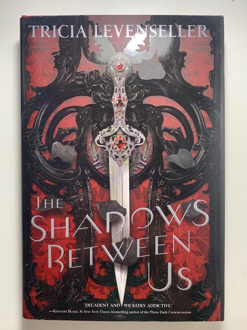 the shadows between us by tricia levenseller, Buku & Alat Tulis, Buku