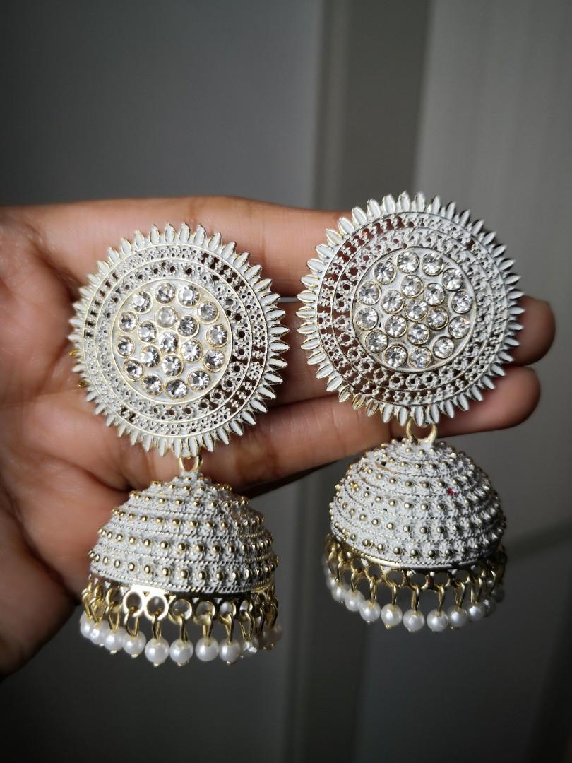 White stone shop jhumkas in gold