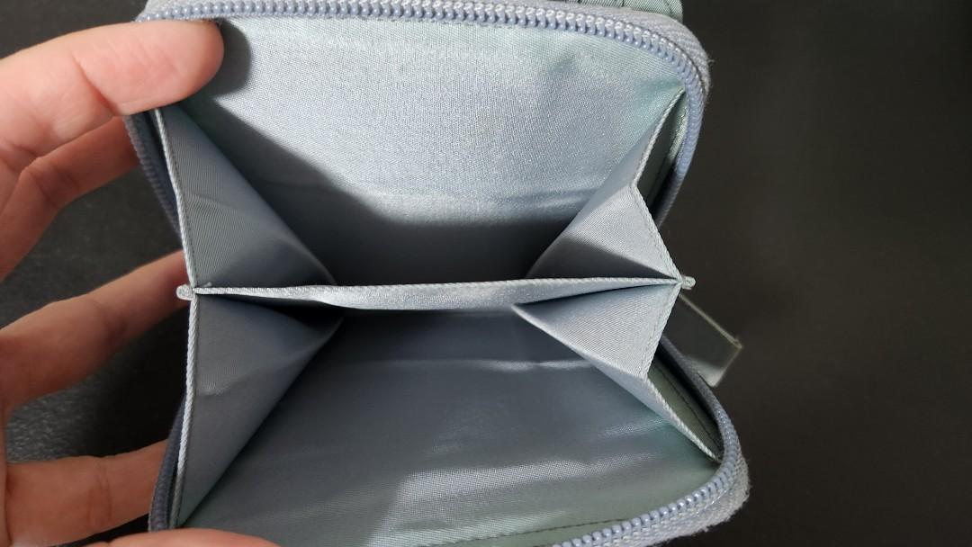 Authentic Prada nylon compact wallet (Category: Luxury Bags & Wallets) located in Quezon City. Submitted by myprelovedfindsph (Listing ID 1191055009, Image 3). Description: Prada nylon compact wallet, in good condition.