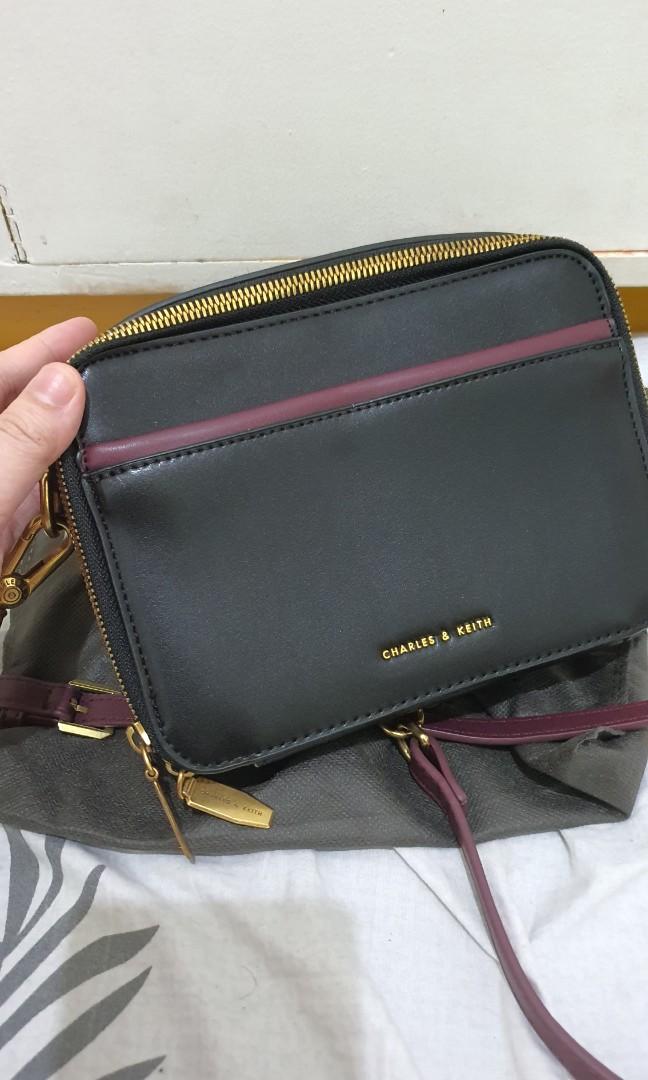 Charles and Keith (Category: Cross-body Bags) located in Bulacan. Submitted by krixa (Listing ID 1190979517, Image 2). Description: Like new, used once Camera Bag Charles & Keith Black- Maroon cross body bag Note: this is not an authentic c&k bag, class A only we can do lalamove, grab (sf c/o buyer) Thank you!.