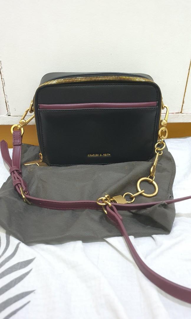 Charles and Keith (Category: Cross-body Bags) located in Bulacan. Submitted by krixa (Listing ID 1190979517, Image 1). Description: Like new, used once Camera Bag Charles & Keith Black- Maroon cross body bag Note: this is not an authentic c&k bag, class A only we can do lalamove, grab (sf c/o buyer) Thank you!.