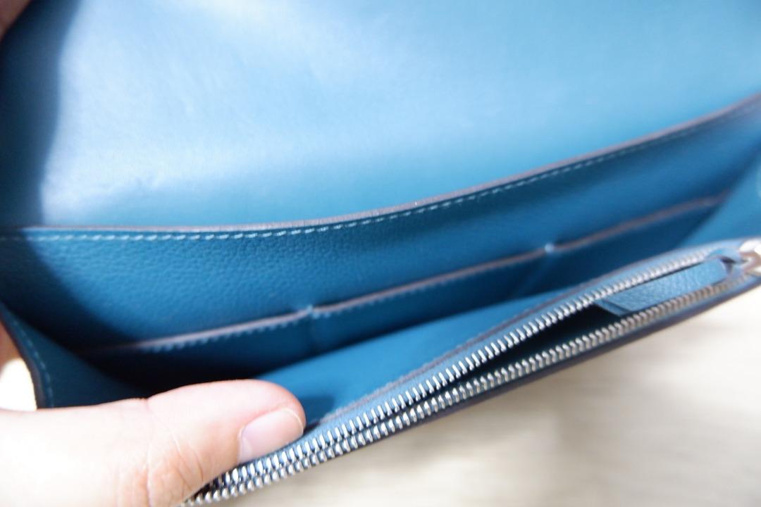 Hermes Dogon Duo Wallet (Category: Luxury Bags & Wallets) located in San Juan City. Submitted by vjla.03 (Listing ID 1191062283, Image 3). Description: Wallet in Togo calfskin with lambskin lining, 5 credit card slots, 3 pockets, and palladium-plated Clou de Selle closure. Measures 7.9" long x 4.9" high x 0.2" deep Retails for $2,175 .
