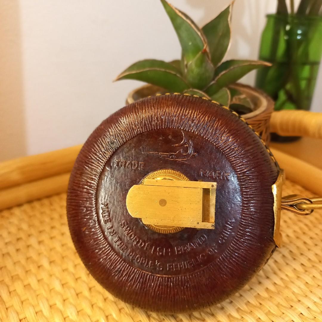 Vintage Swordfish brand leather brass cloth tape measure wind up