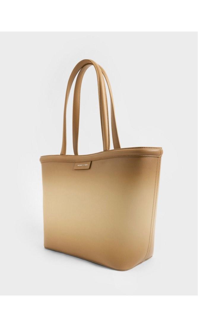 Charles & Keith (Category: Tote Bags) located in Valenzuela. Submitted by allaboutthings12 (Listing ID 1191155600, Image 1). Description: Double handles Magnetic closure Comes with pouch (detachable) Material: Faux leather Depth (cm): 14 Width (cm): 30 Height (cm): 27 With paperbag and dust bag.