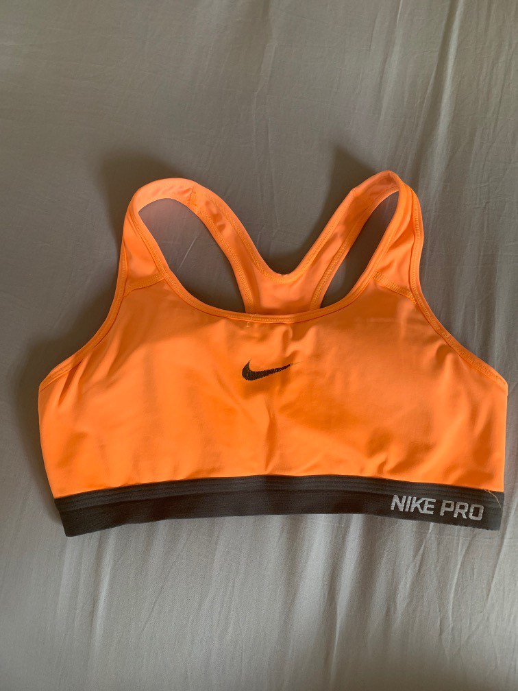 Neon orange Nike sports bra