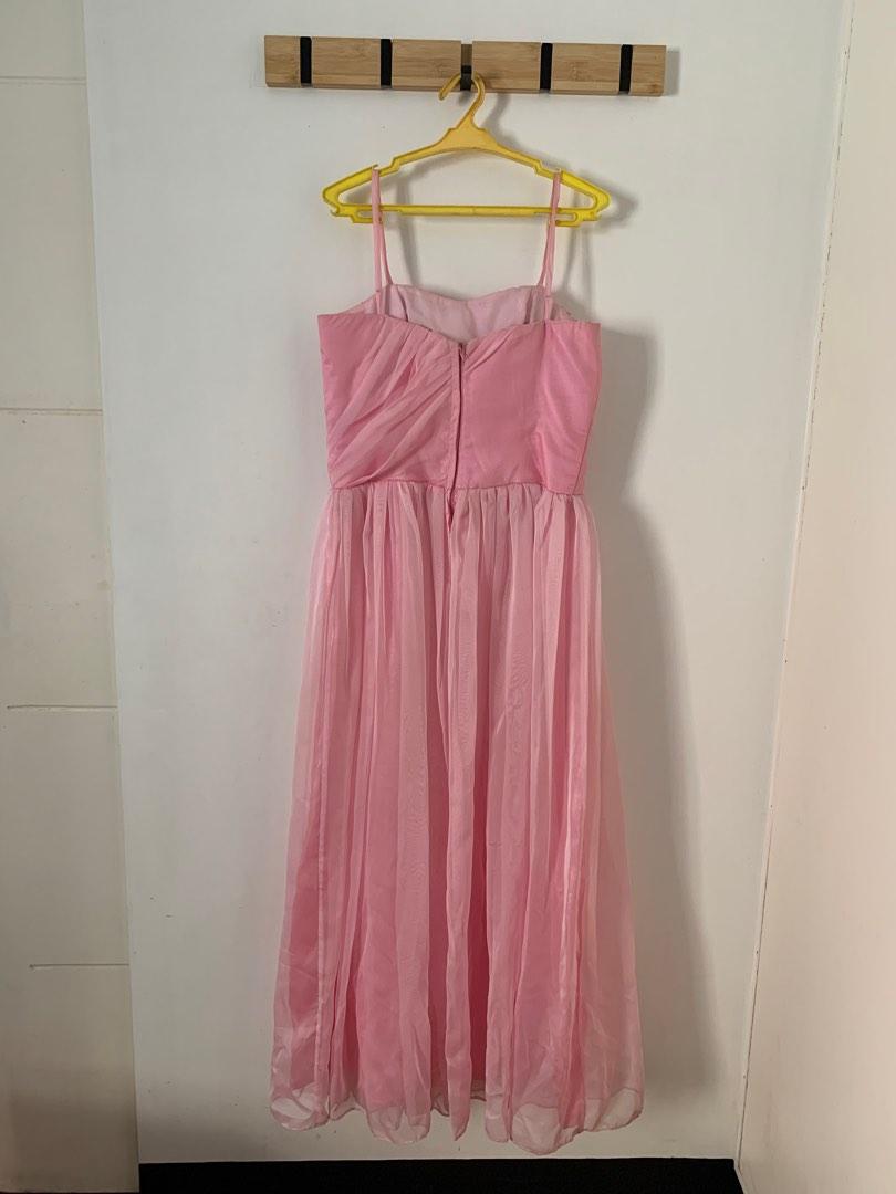 Pink Debut Bridesmaid Gown (Category: Evening dresses & gowns) located in Rizal. Submitted by thriftmanilaxx (Listing ID 1191110556, Image 2). Description: Pink Gown Material: Taffeta silk + froster organza - Custom made - Used once in a wedding - Outer looks new but there’s discoloration in the lining due to storage (see photos) - No stretch, zipped back so take note of measurements Size: Small Bust: 32in no stretch Waist: 27in perfect fit but c