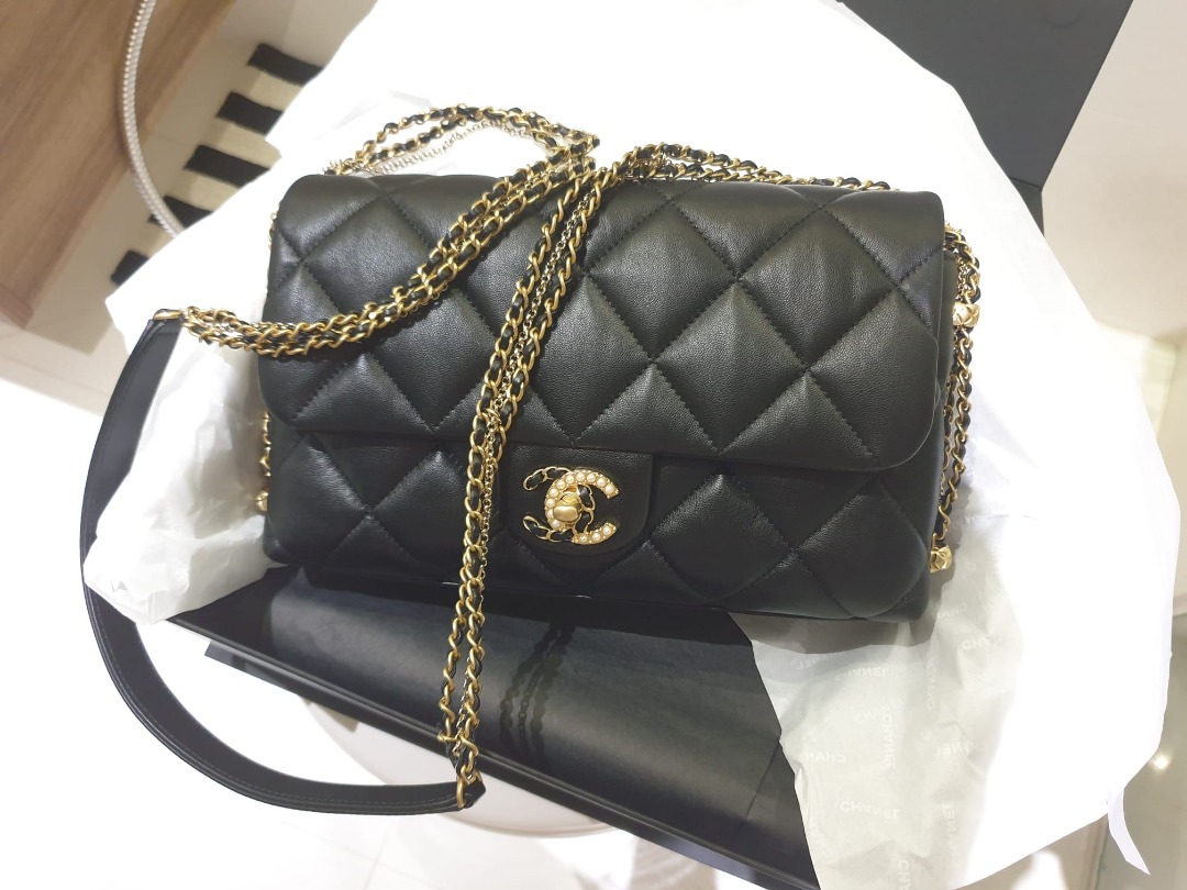 Chanel flap bag with pearl and woven chain cc logo (authentic