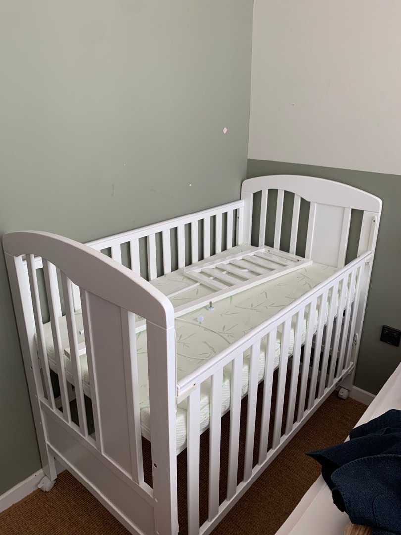 Grey cot mothercare store
