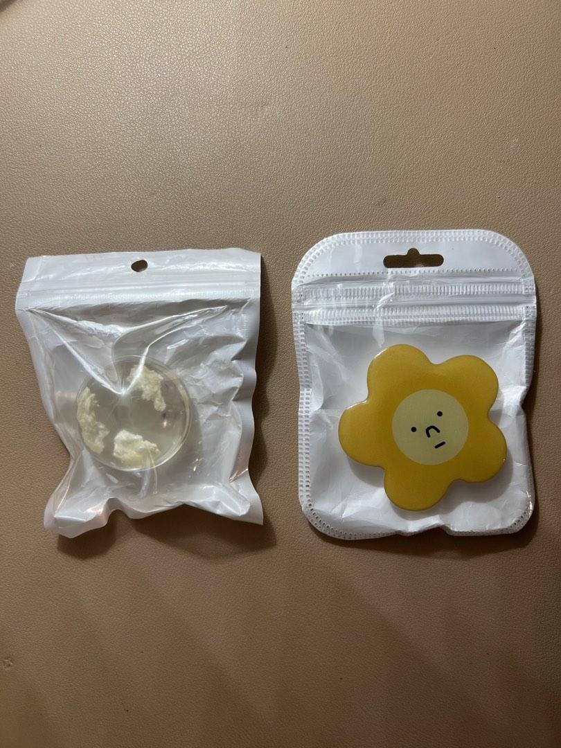 Cute Cloud & Yellow Flower Griptok Phone Holder (Category: Mounts & Holders) located in Manila. Submitted by rkpd1 (Listing ID 1192324677, Image 1). Description: Cute Transparent Cloud & Yellow Flower With Face Griptok • Item: - Never been used, no scratches. - Complete with adhesive tape & Plastic packaging. - Good for any phone - Material: Plastic - You can message me if you only want to buy 1 griptok. • Price: P60 - Shipping fee not included, 