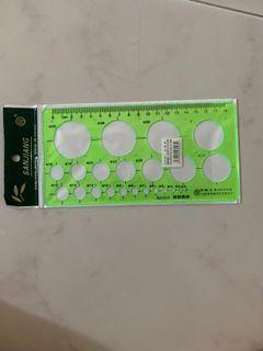 Green plastic circles geometric template ruler stencil measuring tool