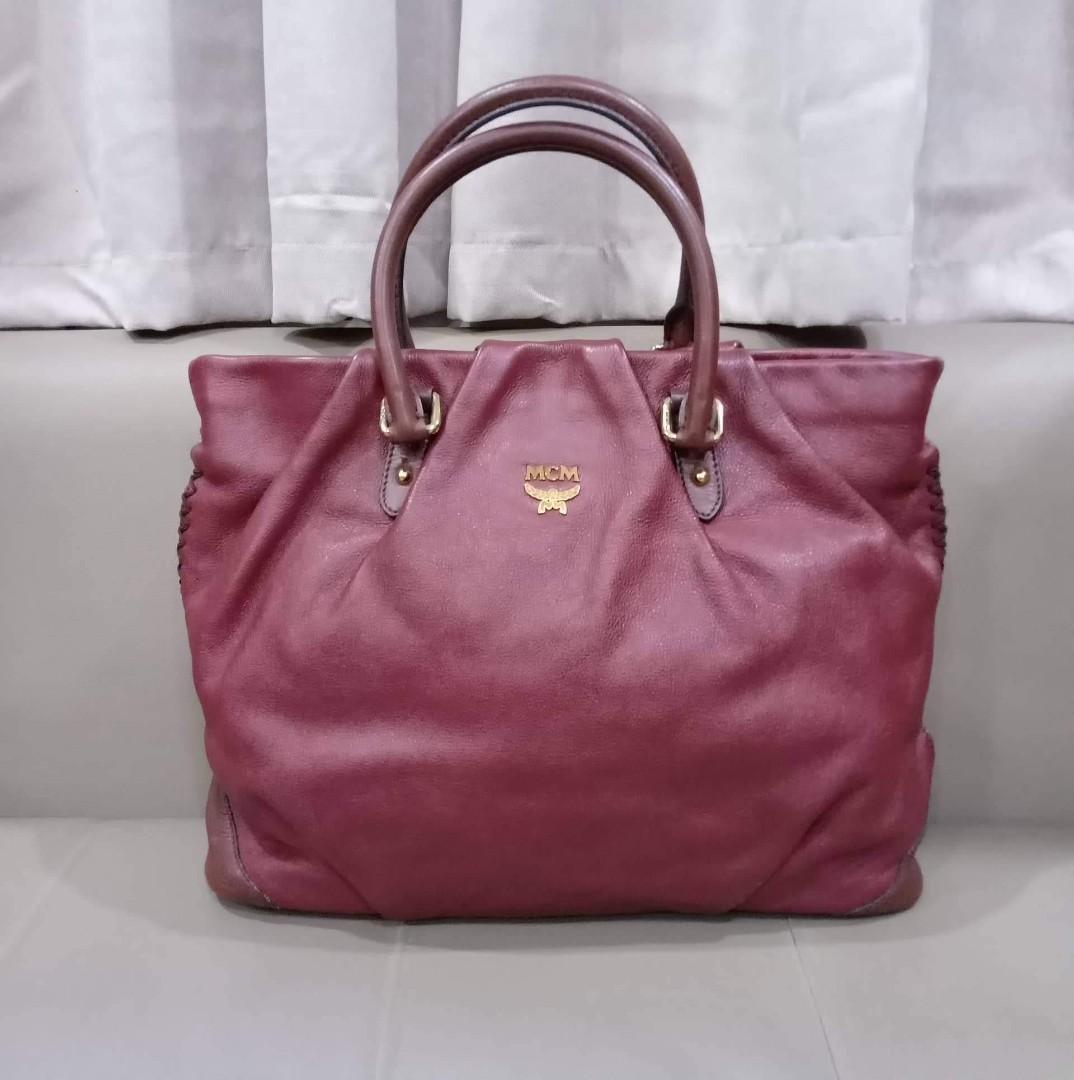 MCM Two Way Tote Bag (Category: Luxury Bags & Wallets) located in Taguig. Submitted by esa.agustin (Listing ID 1192278889, Image 1). Description: Original MCM leather two way bag. With original sling and dust bag. Made in Korea.