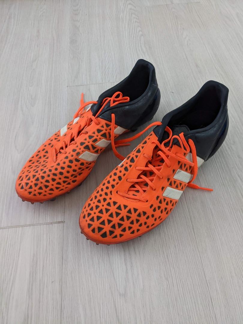 Football shoes orange and black sale