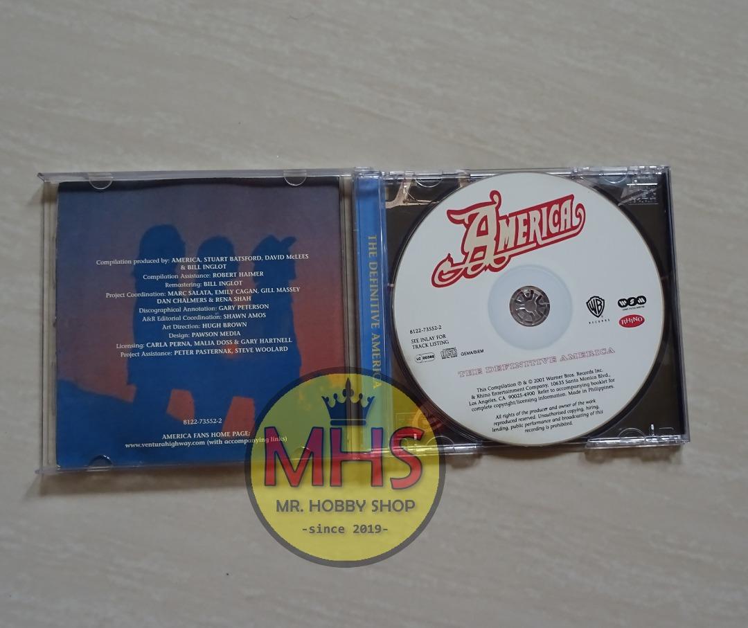 America The Definitive America CD (100M Original Copy), Hobbies & Toys
