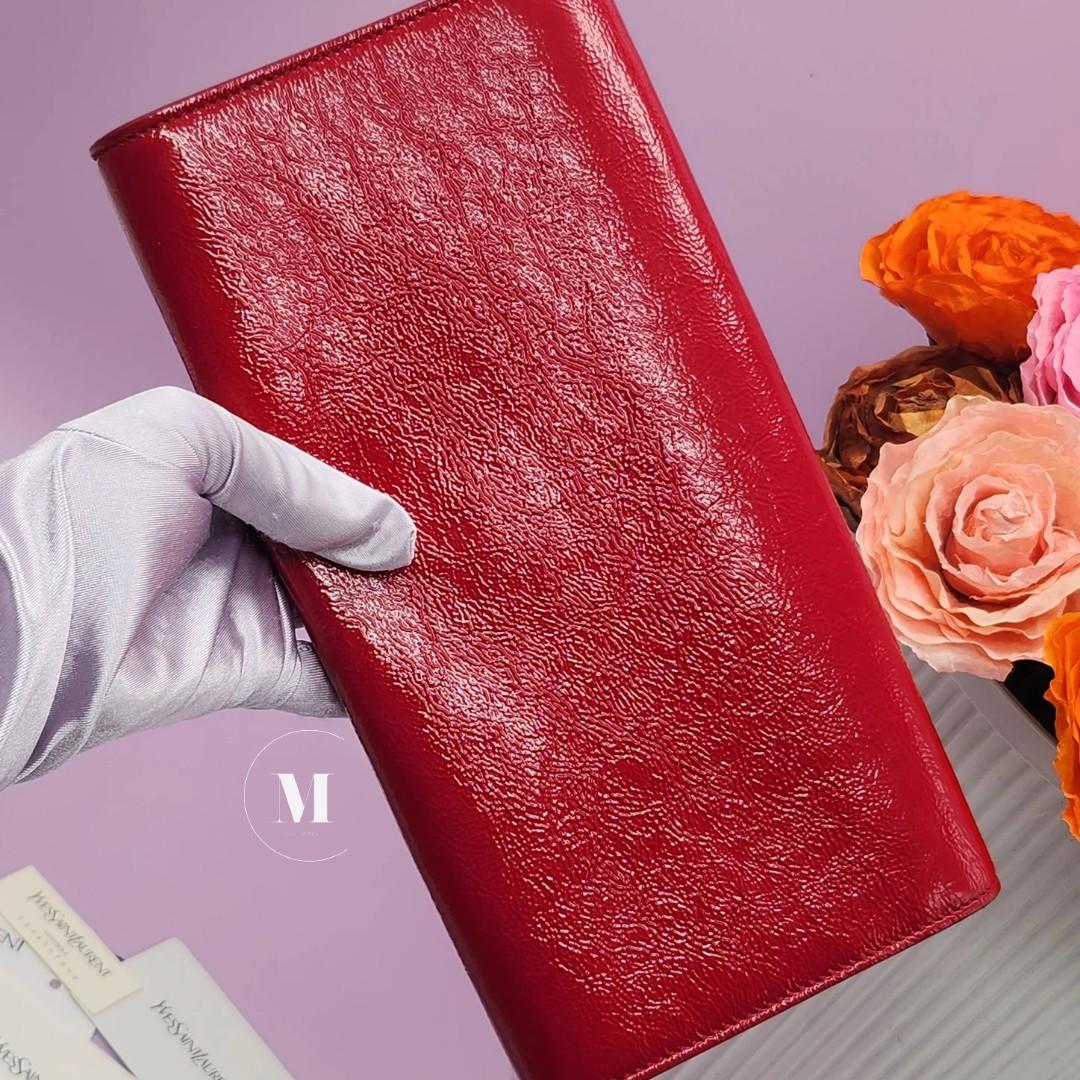 Closing Sale! YSL Red Patent Leather Clutch (Category: Luxury Bags & Wallets) located in Santa Cruz. Submitted by MillesimeCollection (Listing ID 1192611187, Image 3). Description: With original dustbag, care cards and leather swatch Excellent leather condition With free generic chain.