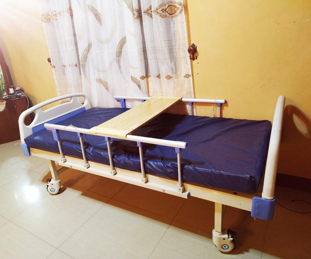 Hospital bed (Category: Medical Supplies & Tools) located in Marilao. Submitted by kaikulit (Listing ID 1192651422, Image 2). Description: 2 crank hospital bed with mattress and table top. Bedside railings are still wrapped in plastic. Used for 2 weeks by patient who underwent heart bypass..
