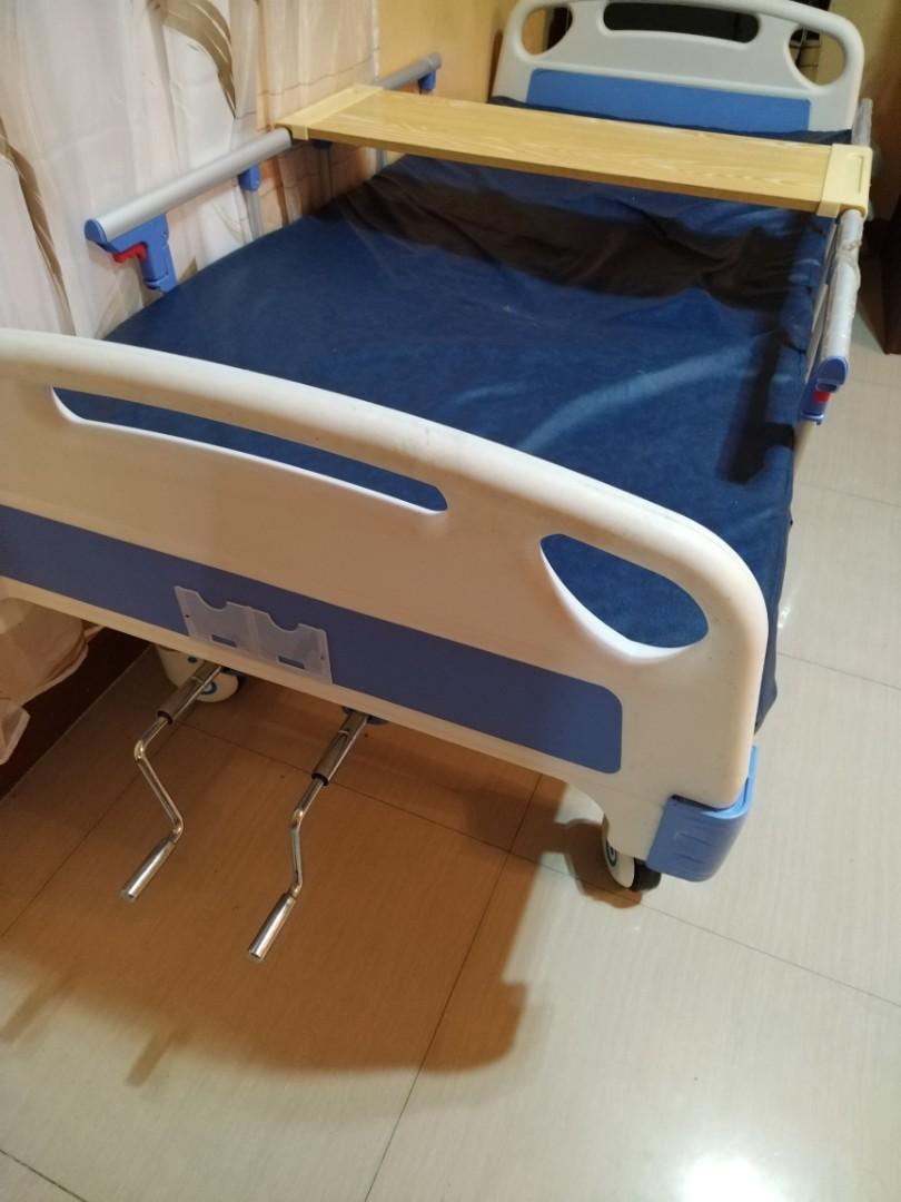 Hospital bed (Category: Medical Supplies & Tools) located in Marilao. Submitted by kaikulit (Listing ID 1192651422, Image 1). Description: 2 crank hospital bed with mattress and table top. Bedside railings are still wrapped in plastic. Used for 2 weeks by patient who underwent heart bypass..