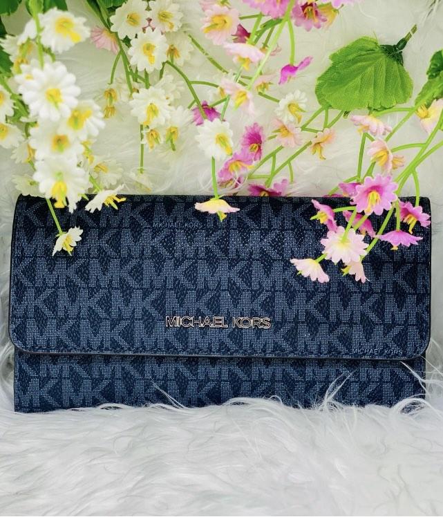 Michael Kors trifold wallet (Category: Luxury Bags & Wallets) located in Makati City. Submitted by copcor (Listing ID 1192923694, Image 1). Description: Brand new Michael Kors trifold blue wallet .