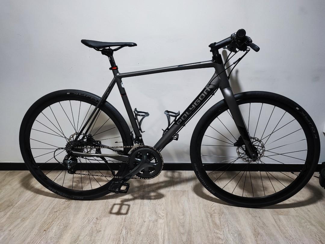 Polygon bend fx4 urban clearance sport disc road bike