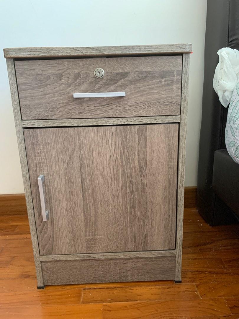 Bedside table (Category: Tables & Sets) located in Singapore. Submitted by jojo_poon (Listing ID 1193042242, Image 1). Description: Door of the cabinet loose but still closes .