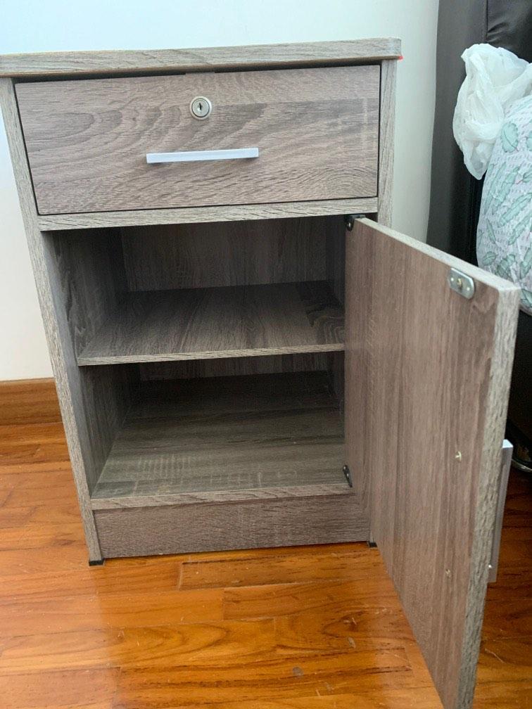 Bedside table (Category: Tables & Sets) located in Singapore. Submitted by jojo_poon (Listing ID 1193042242, Image 2). Description: Door of the cabinet loose but still closes .