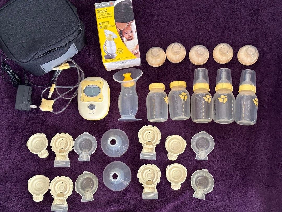 Medela Freestyle Pump with 2 sets of pump accessories, suction pump, 3