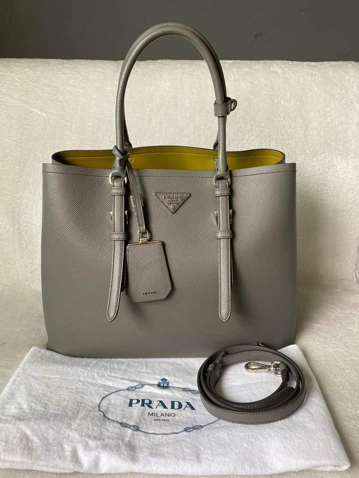 Prada Saffiano Large Cuir Double Bag (Category: Luxury Bags & Wallets) located in Manila. Submitted by bagislifeshop (Listing ID 1193040712, Image 1). Description: ▪️Prada Saffiano Large Cuir Double Bag▪️ ☑️In transit to Manila ✅Condition: 8.8/10 ✅Material: Saffiano leather and nappa lining ✅Colour: Grey in SHW ✅Inclusions: dust bag and long strap.