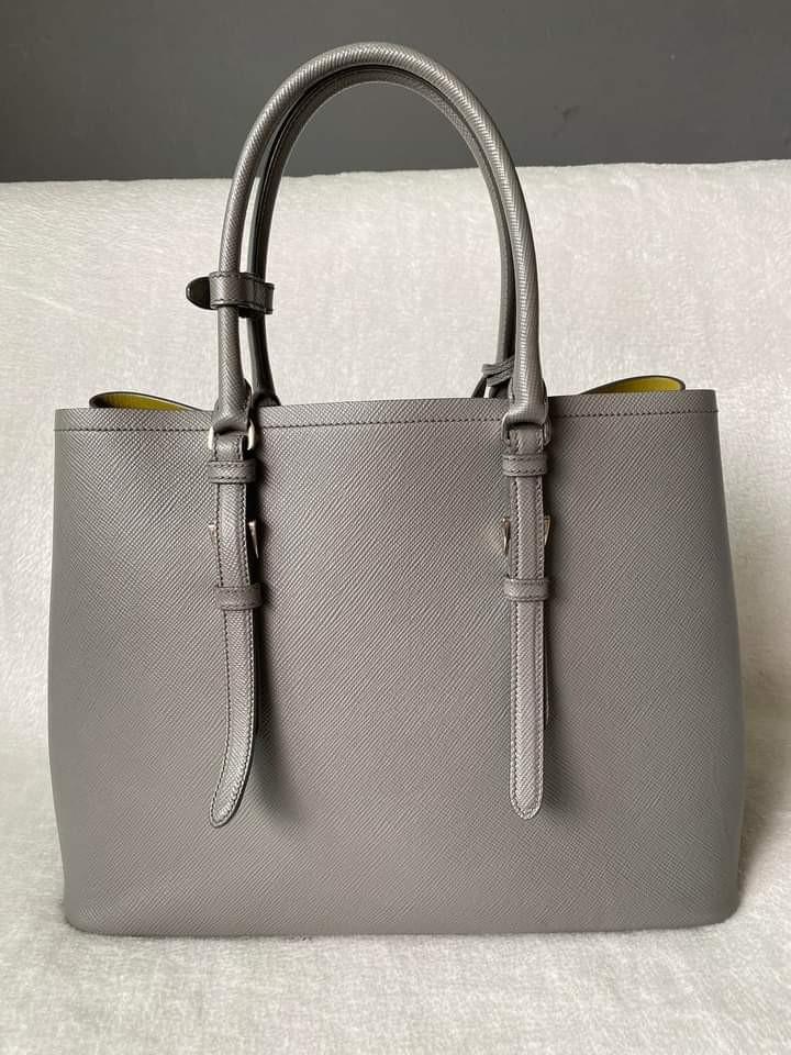 Prada Saffiano Large Cuir Double Bag (Category: Luxury Bags & Wallets) located in Manila. Submitted by bagislifeshop (Listing ID 1193040712, Image 3). Description: ▪️Prada Saffiano Large Cuir Double Bag▪️ ☑️In transit to Manila ✅Condition: 8.8/10 ✅Material: Saffiano leather and nappa lining ✅Colour: Grey in SHW ✅Inclusions: dust bag and long strap.