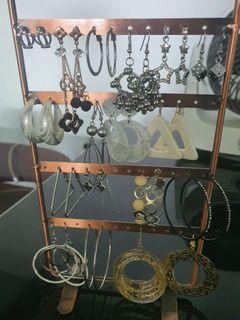 A whole bunch lot of dangling earrings with stand