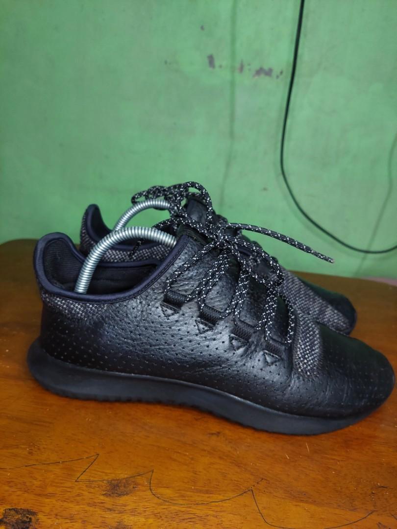 Black tubular trainers store