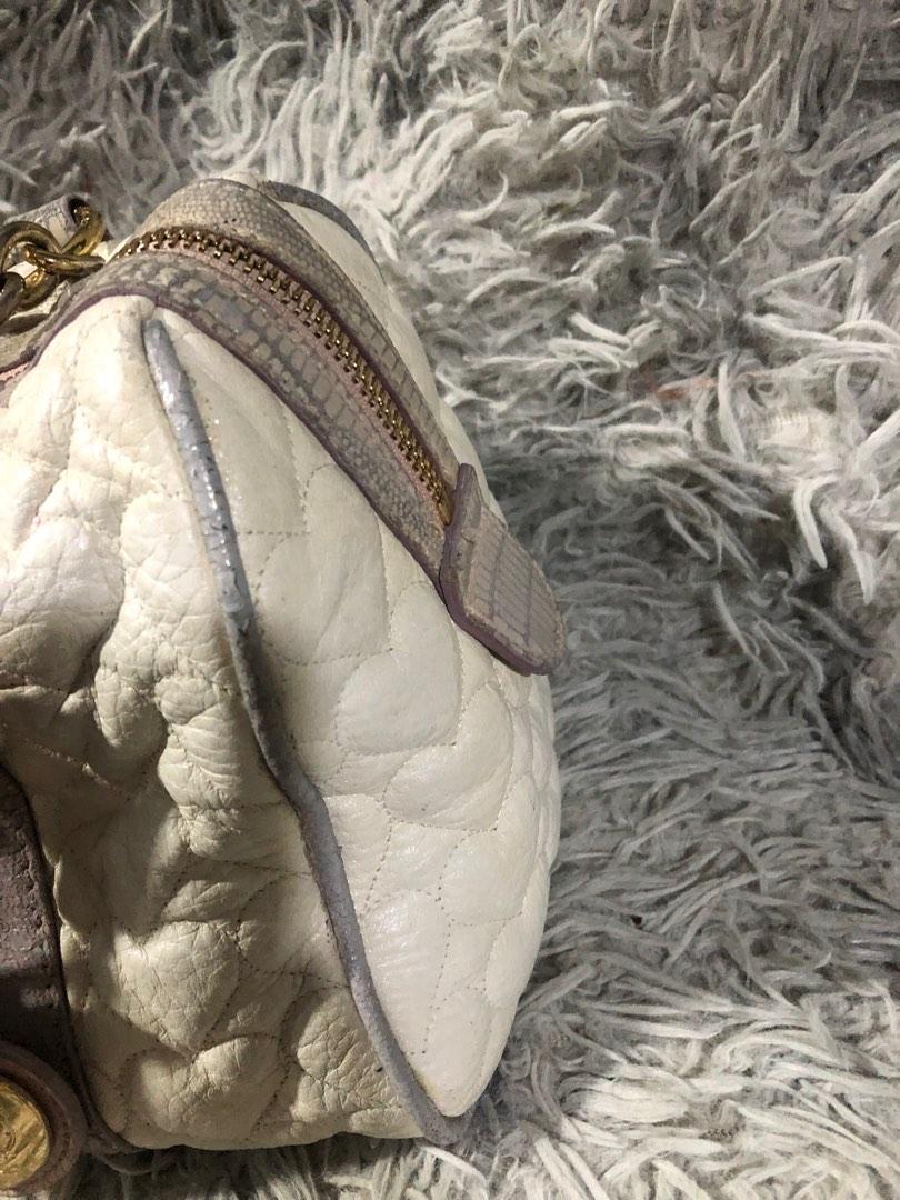 Original love cat shoulder bag (Category: Luxury Bags & Wallets) located in Angono. Submitted by fhlor02 (Listing ID 1193384131, Image 3). Description: Original Lovcat shoulder and hand bag medium size, white genuine leather material, very cute heart quilted design, flaws: tarnished hardware 70% gold.