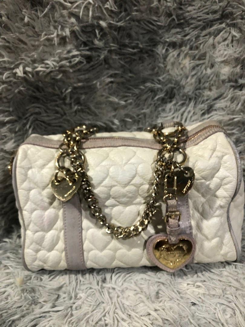 Original love cat shoulder bag (Category: Luxury Bags & Wallets) located in Angono. Submitted by fhlor02 (Listing ID 1193384131, Image 1). Description: Original Lovcat shoulder and hand bag medium size, white genuine leather material, very cute heart quilted design, flaws: tarnished hardware 70% gold.
