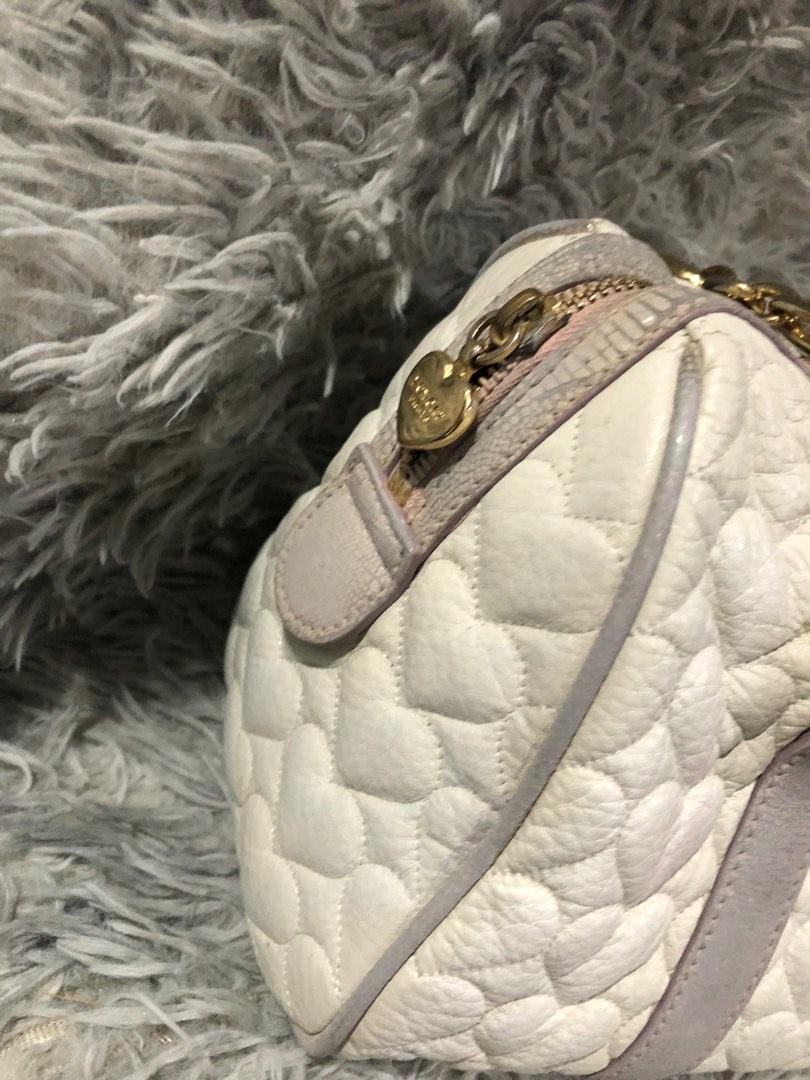 Original love cat shoulder bag (Category: Luxury Bags & Wallets) located in Angono. Submitted by fhlor02 (Listing ID 1193384131, Image 2). Description: Original Lovcat shoulder and hand bag medium size, white genuine leather material, very cute heart quilted design, flaws: tarnished hardware 70% gold.