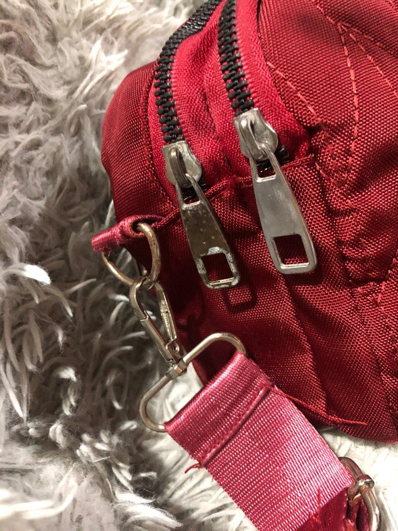 YSL crossbody bag (Category: Luxury Bags & Wallets) located in Angono. Submitted by fhlor02 (Listing ID 1193385929, Image 2). Description: YSL crossbody bag, maroon nylon material, fashion bag only, no etiketa or code inside, small to medium in size, has three compartment.