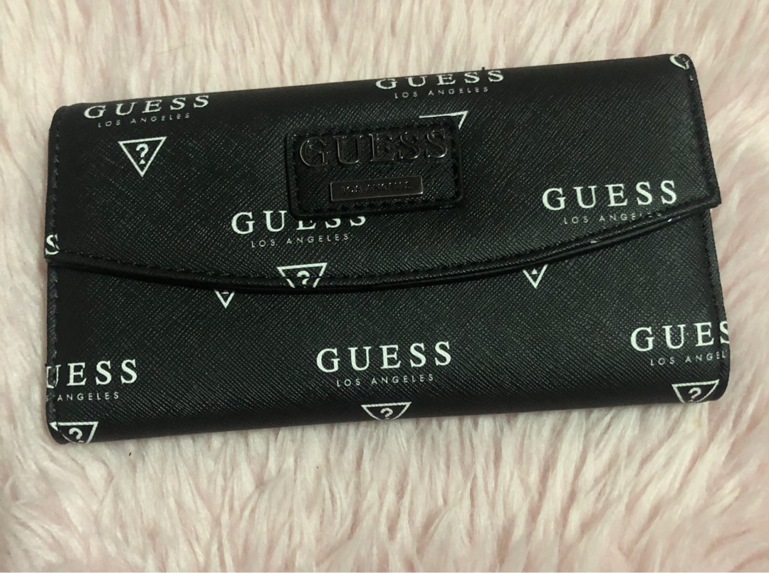 Guess Wallet (with minor flaw), Women's Fashion, Bags & Wallets, Wallets & Card holders on Carousell