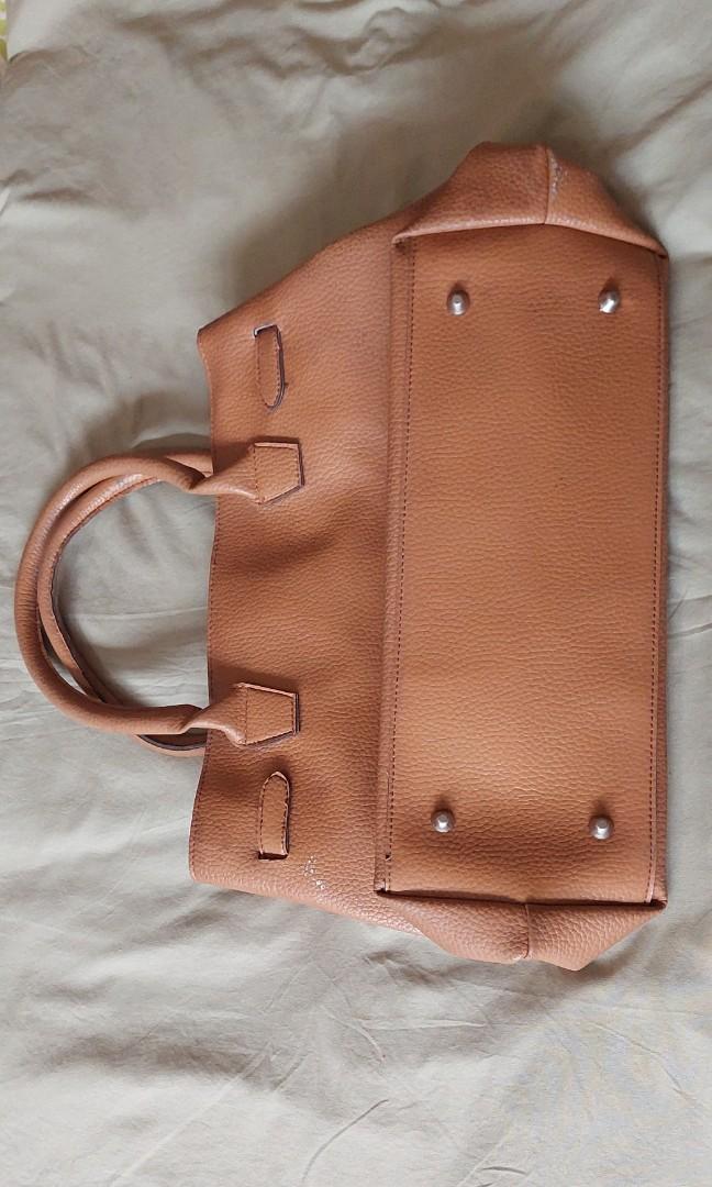 Birkin-like bag in Taurillon Leather (Category: Luxury Bags & Wallets) located in Quezon City. Submitted by mariieee_ (Listing ID 1188448038, Image 2). Description: No brand Real, taurillon leather Advised for Cleaning The metal is detached from the lock Negotiable RFS: Decluttering.