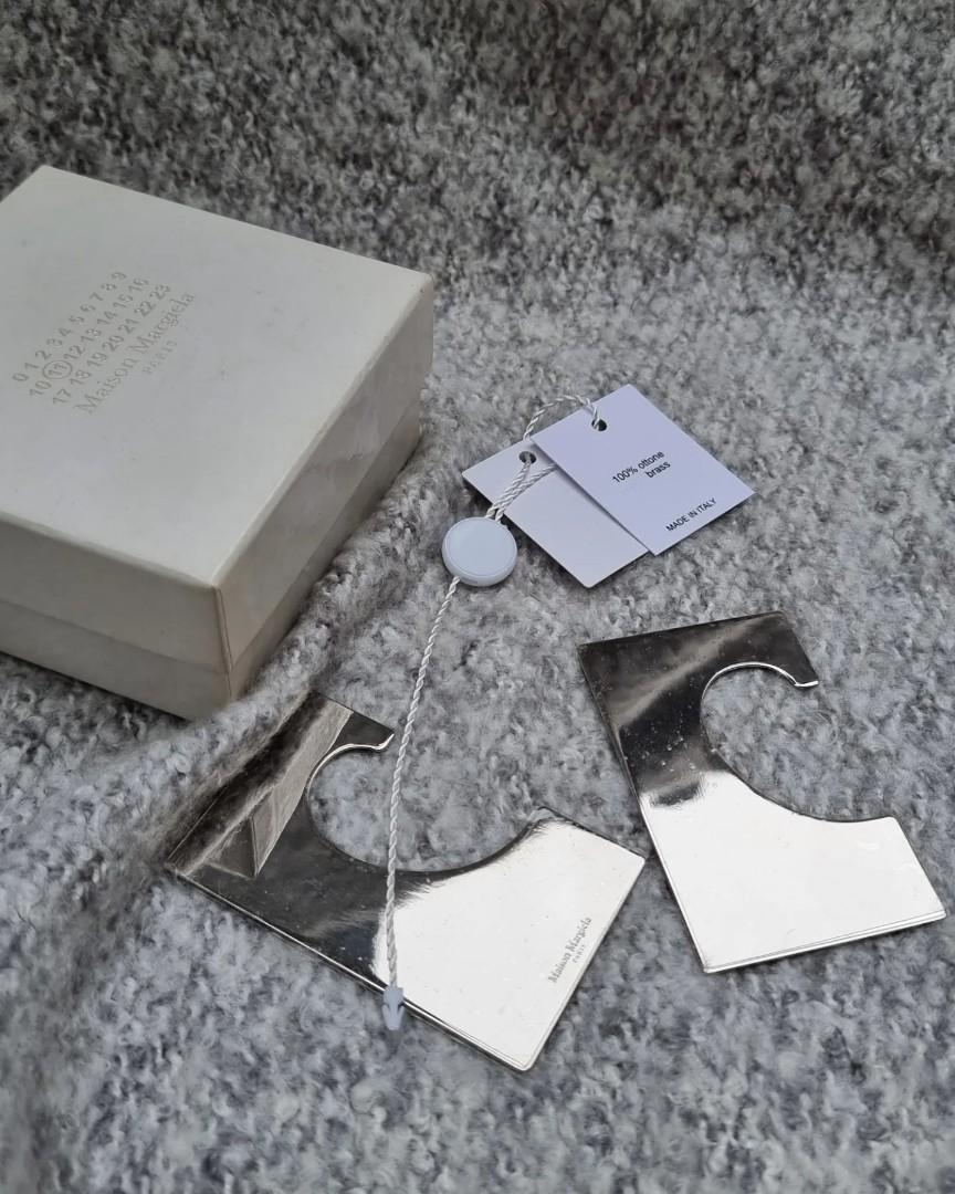 MAISON MARGIELA Silver Tone Ear Cuffs (Category: Earrings) located in Quezon City. Submitted by lolaandrogynous (Listing ID 1188574385, Image 1). Description: MAISON MARGIELA Silver Tone Ear Cuffs Comes with its original box and tags 10/10 (In NEW condition).
