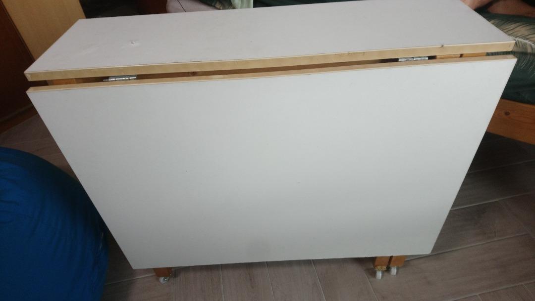 Space Saving multi purpose Folding Table (Category: Tables & Sets) located in Singapore. Submitted by dolphin195 (Listing ID 1188450021, Image 3). Description: Folding table that can be used as study or dining or multi purpose. Breadth 33 n half inch, n if open one side 33 inch, height 30inch with wheel Space Saving and Opens on either side with 2 drawers in the centre. I have fixed small wheels to the table for easy moving around the house(1 of 