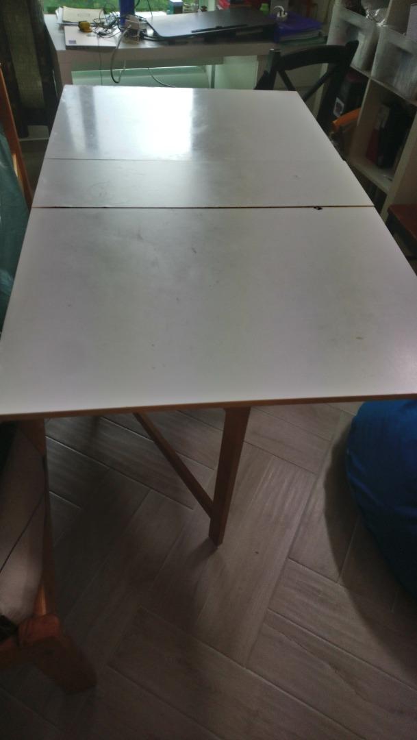 Space Saving multi purpose Folding Table (Category: Tables & Sets) located in Singapore. Submitted by dolphin195 (Listing ID 1188450021, Image 2). Description: Folding table that can be used as study or dining or multi purpose. Breadth 33 n half inch, n if open one side 33 inch, height 30inch with wheel Space Saving and Opens on either side with 2 drawers in the centre. I have fixed small wheels to the table for easy moving around the house(1 of 
