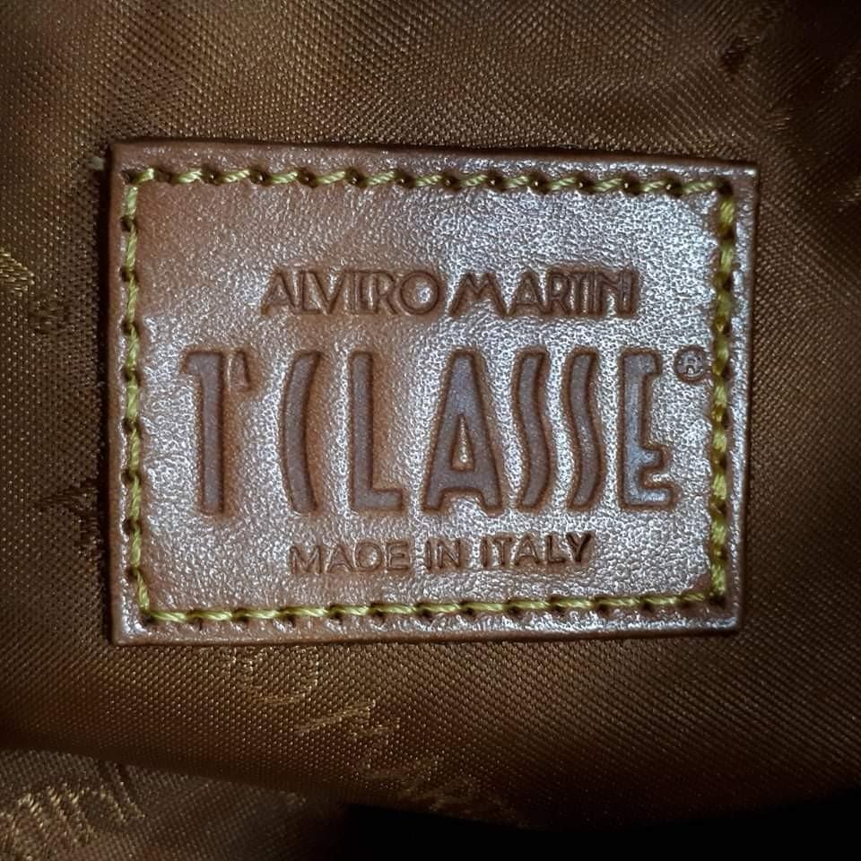 Alviero Sling Bag (Category: Luxury Bags & Wallets) located in Taguig. Submitted by esa.agustin (Listing ID 1193629918, Image 2). Description: Original Alviero minigram pvc leather sling bag. Made in Italy..