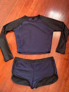 Black and navy blue cropped rash guard with shorts