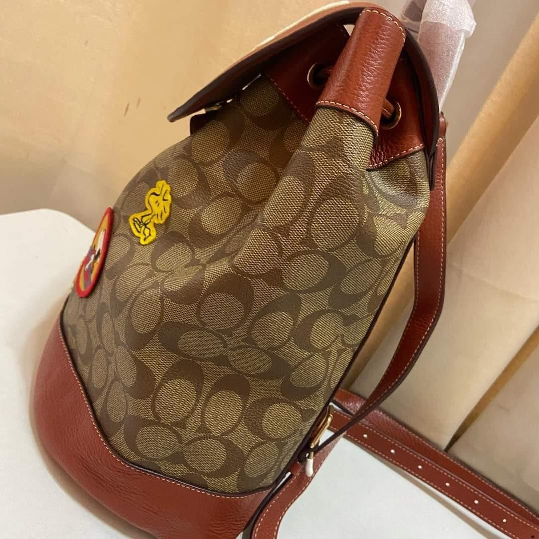 Coach X Peanuts Dempsey Drawstring Backpack In Signature Canvas With