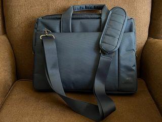 13” laptop bag. Original Rivacase Navy Blue with multiple pockets and shoulder strap