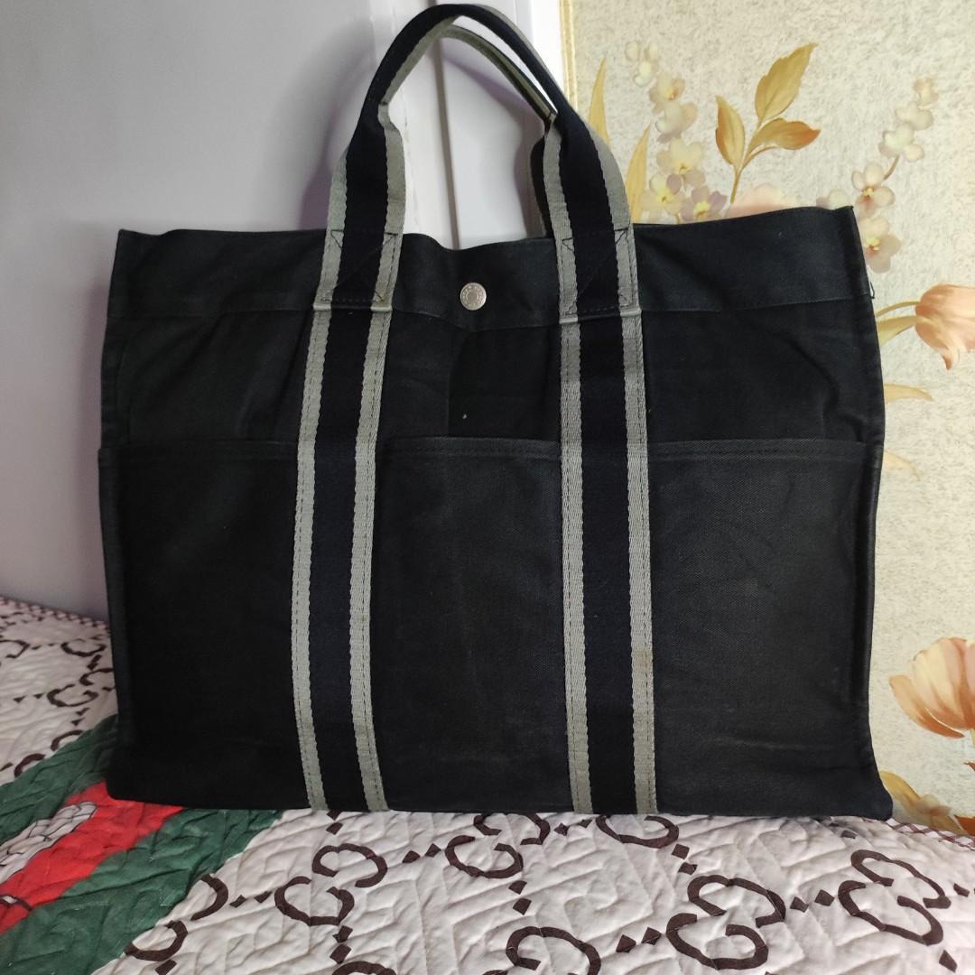 🇯🇵💯Hermes Fourre Tout👜 (Category: Luxury Bags & Wallets) located in Makati City. Submitted by yerbua103 (Listing ID 1193908857, Image 1). Description: 👛 🇯🇵Hermes black Fourre Tout Canvas rectangular tote with durable top handles, with 6 exterior slip pockets, silver-toned Hermes branded snaps, top snap closure, wide zipped pocket inside with leather pull. It is made of thick canvas material and is extremely durable. It can fit a 15-inch la