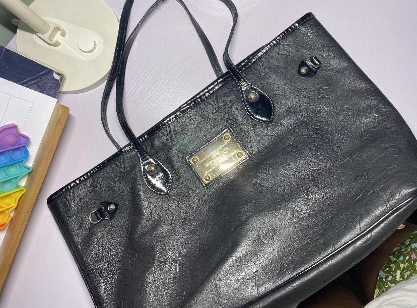 Louis vuitton with gold plate on front store
