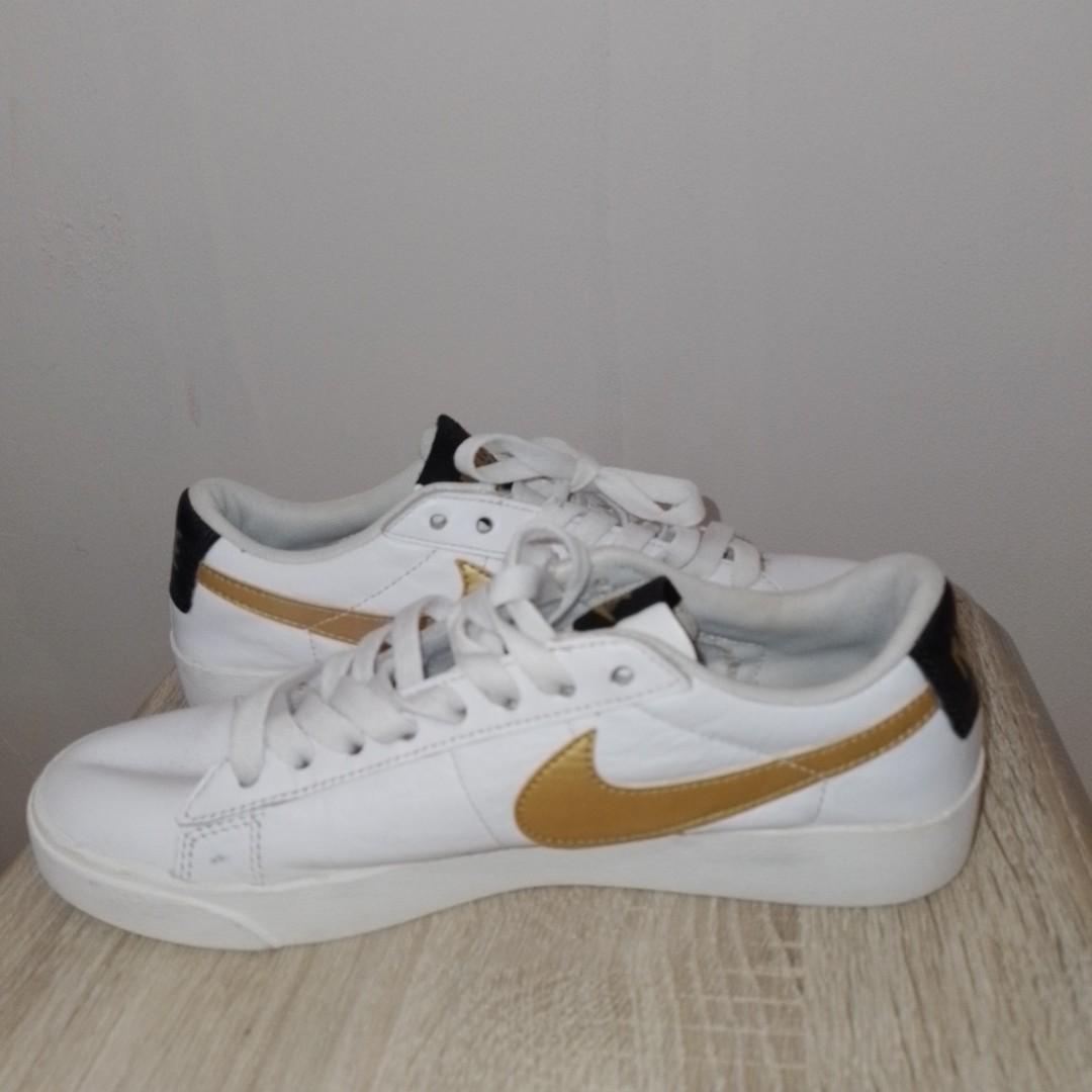 white nike athletic shoes