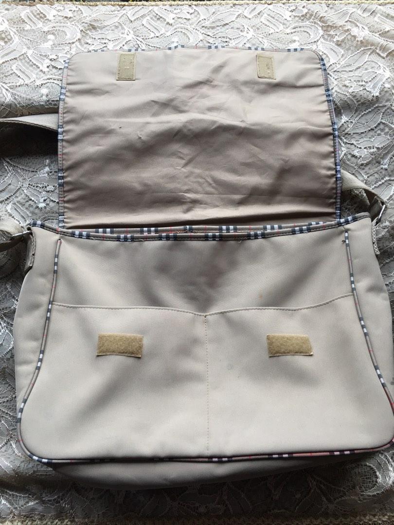 Burberry Fragrance Messenger Bag (Category: Sling Bags) located in Marikina City. Submitted by arrveefm (Listing ID 1189204523, Image 3). Description: Original Burberry Fragrance Messenger Bag Heavily USED, kindly refer to pictures. Fixed Selling Price: Php 850.00 (Shipping NOT YET included; Php 200 via JRS) Visible scratches/minor cuts on fabric, care tag inside heavily scratched, visible ink stains, minor visible rust on all metal due to age; r